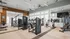 Modern fitness center with state-of-the-art gym equipment, bright and airy space, and sleek interior design.