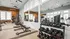 Bright and modern gym featuring state-of-the-art equipment, including free weights and cardio machines, with large windows for natural light.