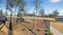 Charming playground with slides in a landscaped community setting, perfect for family fun.