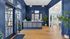 Inviting luxury apartment lobby with elegant blue walls, large windows, and stylish modern decor.