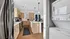 Contemporary kitchen with sleek stainless steel appliances, elegant wood cabinetry, and a convenient in-unit washer and dryer.