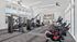 Bright and modern fitness center featuring state-of-the-art exercise equipment, large windows, and sleek design for an invigorating workout experience.