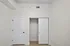 Chic interior closet space with sleek white doors and modern design, perfect for organized living.