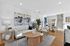 Bright, modern living room with elegant decor, stylish white sofa, and warm wood accents creating a welcoming atmosphere.