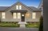 Charming single-story home with inviting front entrance and well-maintained landscaping.