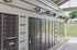 Modern apartment community mail center with secure, organized mailboxes under stylish lighting.