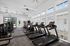 Bright, modern fitness center with state-of-the-art treadmills and exercise equipment, perfect for an energetic workout session.