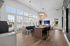 Modern apartment with elegant dining area featuring large windows, wooden floors, stylish pendant lights, and a refreshing pool view.