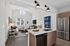 Bright and modern apartment kitchen and living area with sleek appliances, cozy seating, and abundant natural light.