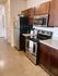 Open kitchen with ample storage space.