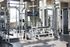 State-of-the-art gym with modern equipment including weights, kettlebells, and exercise machines.
