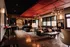 Stylish lounge area featuring modern industrial design, leather seating, and artistic lighting.