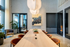 Chic modern meeting room with elegant wooden table, stylish chairs, and artistic wall d&eacute;cor.
