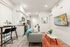 Modern and cozy apartment living space with sleek kitchen, stylish dining area, and vibrant decor.