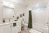 Elegant bathroom design with modern fixtures, sleek vanity, and a calming bathtub, perfect for relaxation.