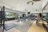 Inviting fitness center with modern exercise equipment and bright natural light, perfect for an energizing workout.