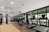 Modern fitness center with state-of-the-art treadmills and exercise equipment, bright and inviting with large windows.