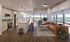Modern open-plan living space with stylish kitchen, cozy lounge, and stunning panoramic city views.