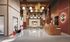 Luxurious apartment lobby with modern design, featuring elegant lighting fixtures, stylish seating area, and chic decor.