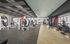 Modern gym facility with state-of-the-art equipment, featuring cardio machines and strength training areas, complemented by sleek interior design and ample natural light.