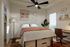 Modern bedroom with cozy decor, showcasing a stylish bed, vibrant wall art, and a scenic view from the window. Perfect for relaxation and inspiration.