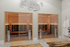 Elegant modern sauna with warm wooden interiors and stylish tile flooring, perfect for relaxation and rejuvenation.