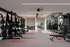Modern gym with state-of-the-art equipment, sleek design, and ample space for an invigorating workout experience.