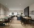Chic, contemporary living space featuring elegant seating, natural light from large windows, and stylish decor.