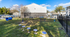 Inviting outdoor play area with colorful equipment and lush greenery, perfect for family fun in a vibrant community setting.