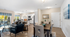 Inviting open-concept living space with elegant dining area, modern kitchen, and cozy seating, enhanced by abundant natural light and tasteful decor.