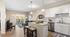 Bright and inviting open-concept kitchen and living room featuring modern furnishings, sleek white cabinetry, and a cozy balcony view.