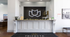 Modern lobby with stylish reception desk, elegant wall decor, and inviting ambiance at Trifecta Apartments.
