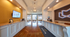 Luxurious apartment lobby featuring elegant recessed lighting, polished floors, and a welcoming reception desk at Trifecta Apartments.