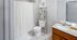 Bright, modern bathroom with stylish granite countertop, elegant shelving, and a charming shower curtain.