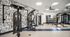 Modern fitness center with state-of-the-art gym equipment, featuring stylish decor and ample natural light.