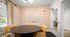 Chic meeting room with retro orange patterned wallpaper, elegant round table, and cozy chairs, perfect for collaborations.