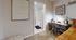 Cozy home office space with stylish desk, modern lighting, and inviting decor, perfect for focused work sessions.
