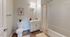 Bright and inviting bathroom with modern fixtures, elegant vanity, and sleek shower. Perfect for a refreshing start to your day.