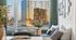 Chic urban apartment with a cozy living area, elegant dining setup, and breathtaking cityscape view through expansive windows.