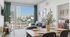 Modern apartment interior showcasing a cozy living room with a city view, elegant dining area, and a beautifully styled bedroom.