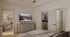 Primary bedroom view featuring mounted television, dresser, walk-in closet, ensuite bathroom, and adjacent living area access.