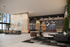 Modern apartment lobby with sleek seating areas, stylish lighting, and lush vertical garden.