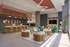 Modern, vibrant community lounge featuring plush seating, sleek workstations, and stylish decor at Theory.