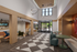 Inviting lobby showcasing modern design with geometric flooring, stylish seating, and contemporary lighting.