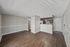 Open living room and kitchen layout with wood-style flooring