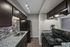 One-bedroom apartment kitchen with granite countertops and modern tile backsplash