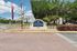 Vetra West Community Entrance Sign with Palm Trees and Main Road Access