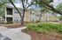 Apartment Community Exterior with Mature Trees and Lush Landscaping