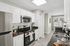 Open Kitchen with Breakfast Bar and Stainless Steel Appliances