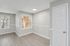 Dining area with wood-style flooring, large windows, and neutral walls